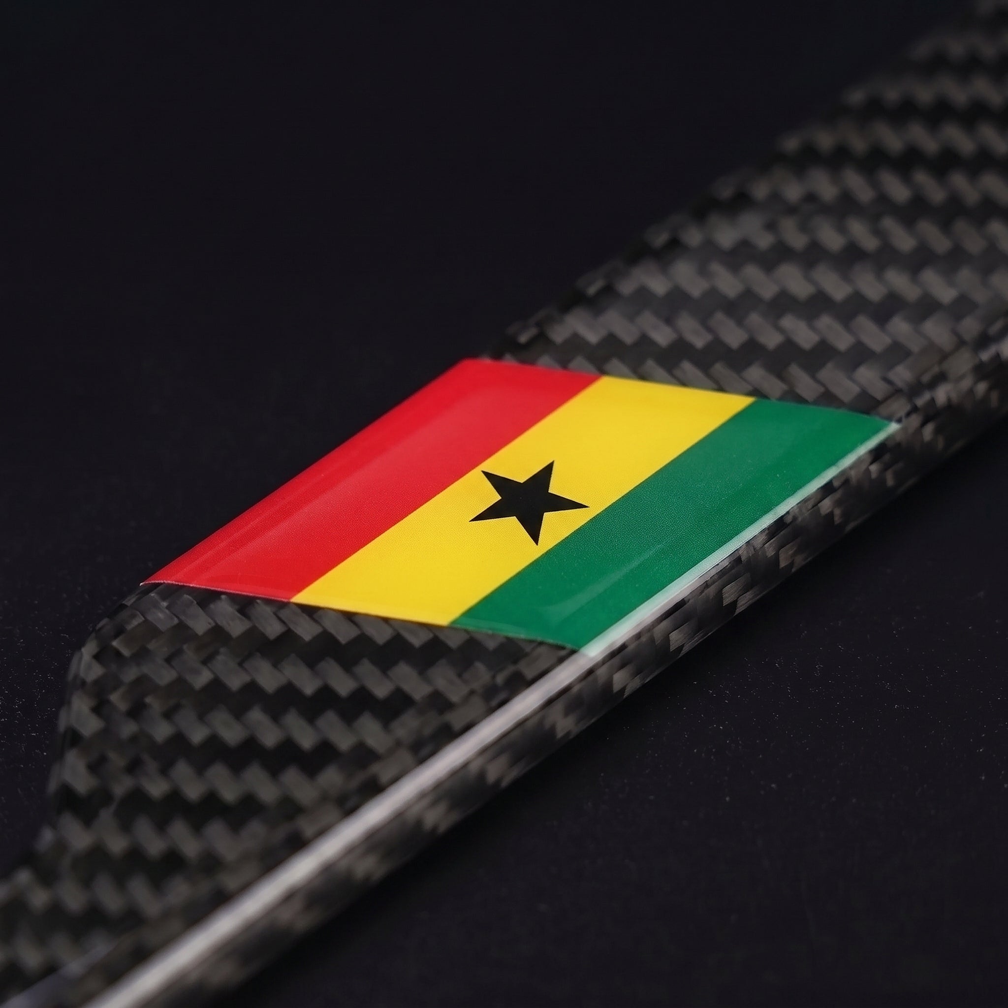 Macro of the Ghana flag inlay on a PSF Carbon carbon fiber license plate frame