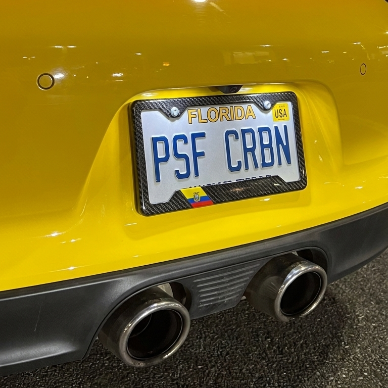 Ecuador carbon plate frame close-up on yellow Porsche 911