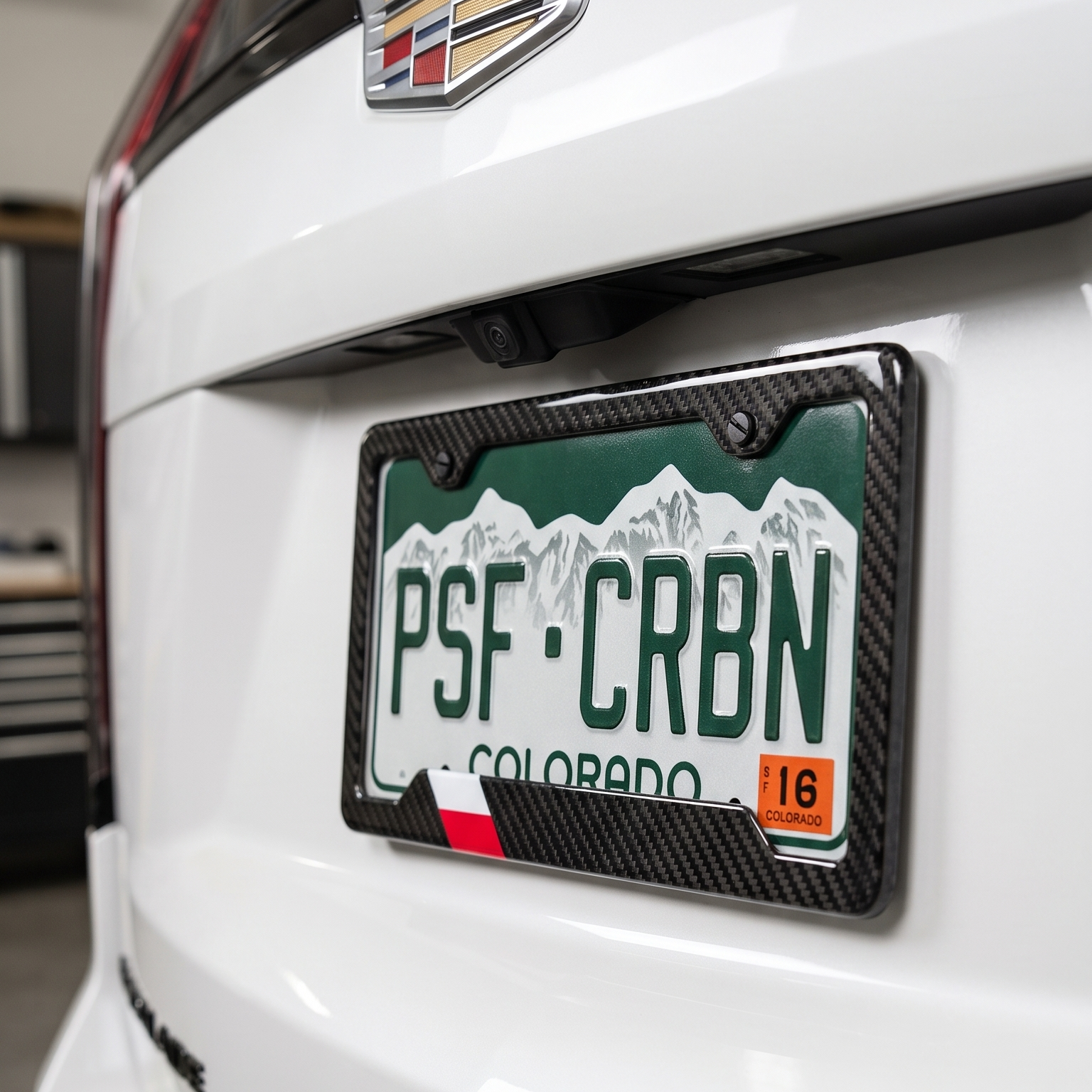 Poland flag carbon fiber license plate frame close-up on white Cadillac Escalade