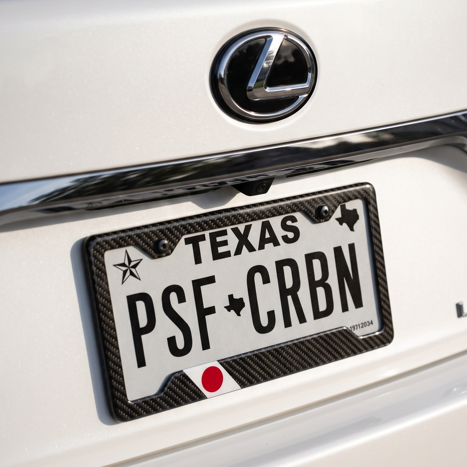 Japan flag carbon fiber license plate frame on Lexus LS, close-up, Texas plate PSF CRBN
