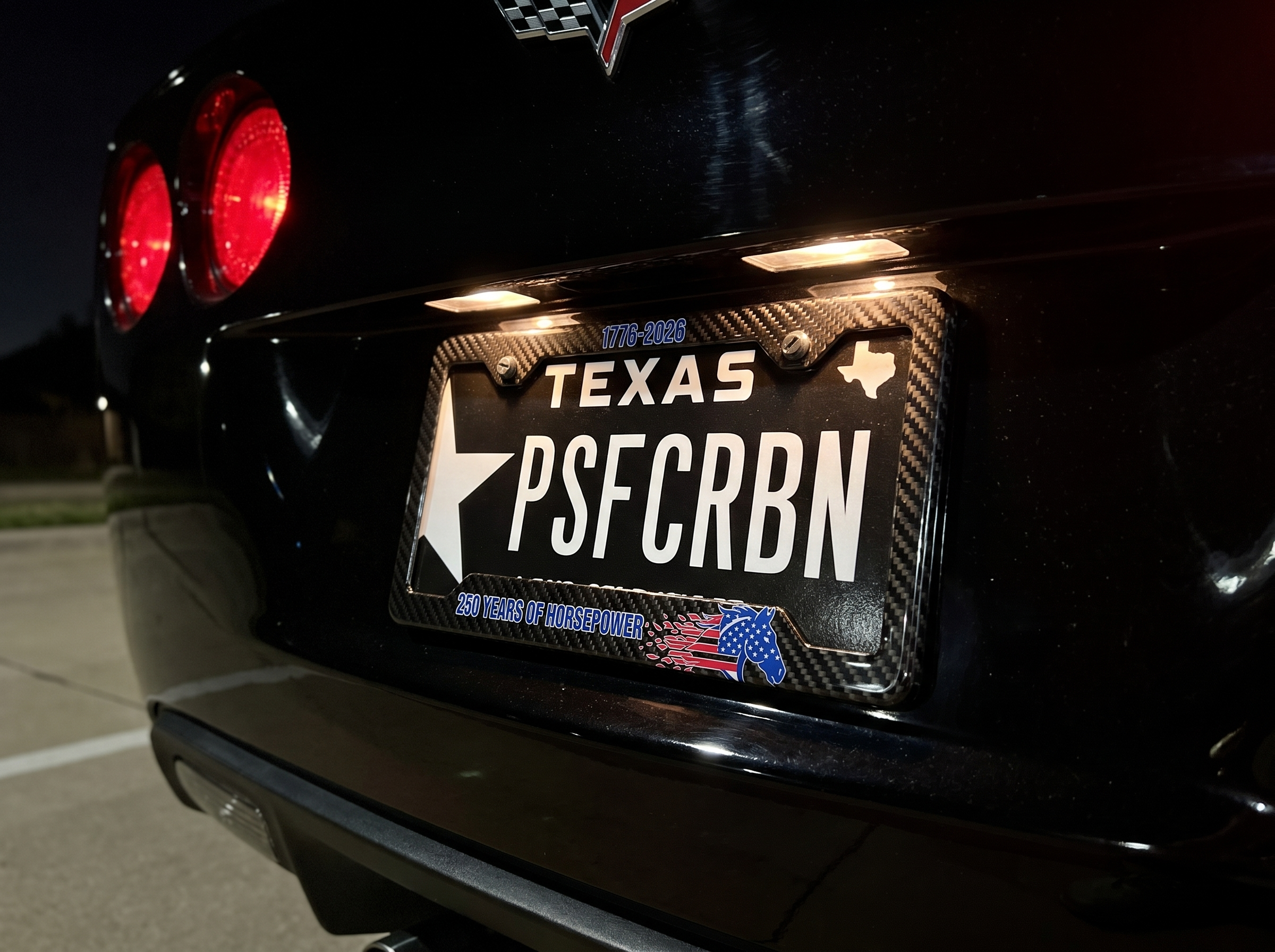 250 Years of Horsepower frame on Corvette at night