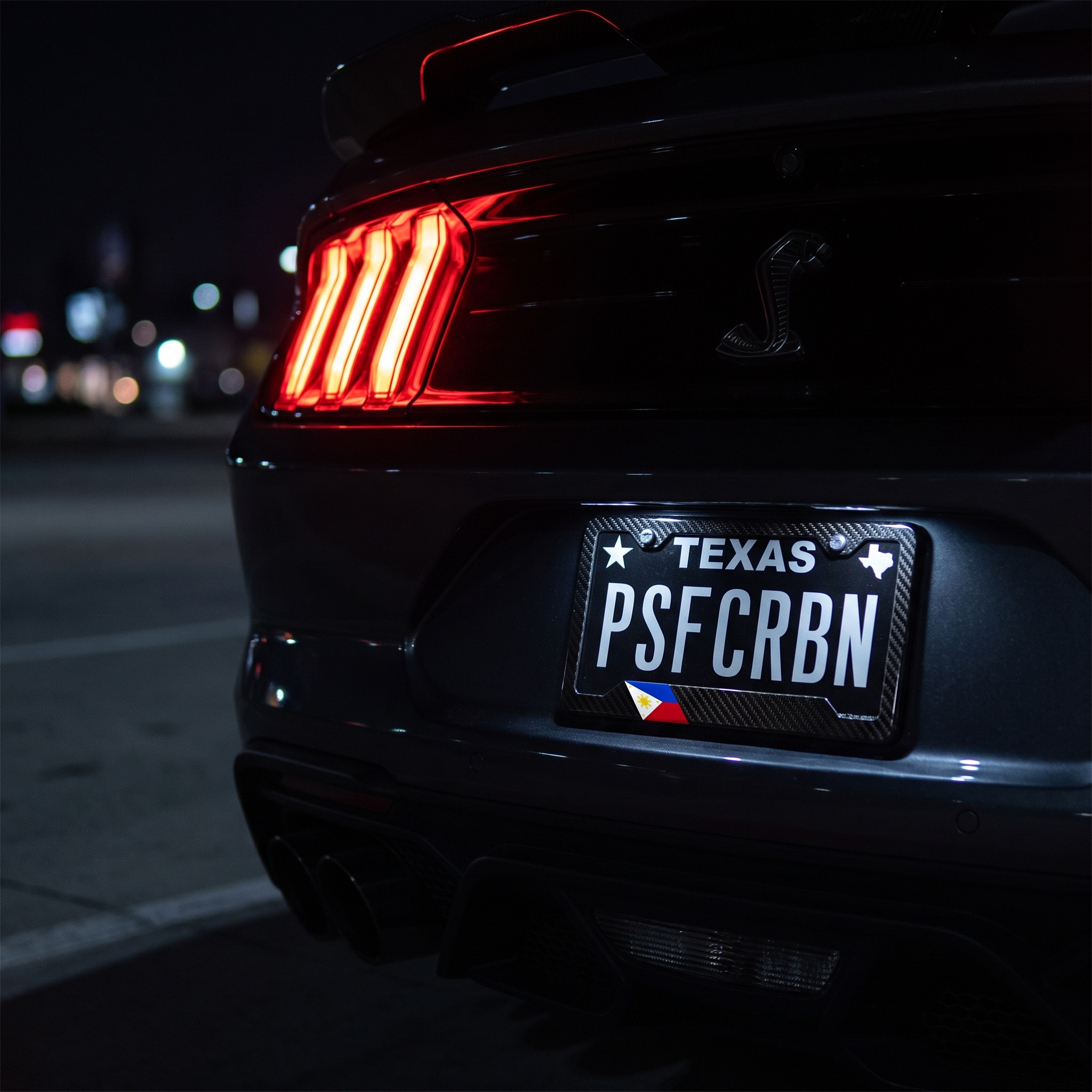 Philippines flag carbon fiber license plate frame on Ford Mustang Shelby GT500 at night