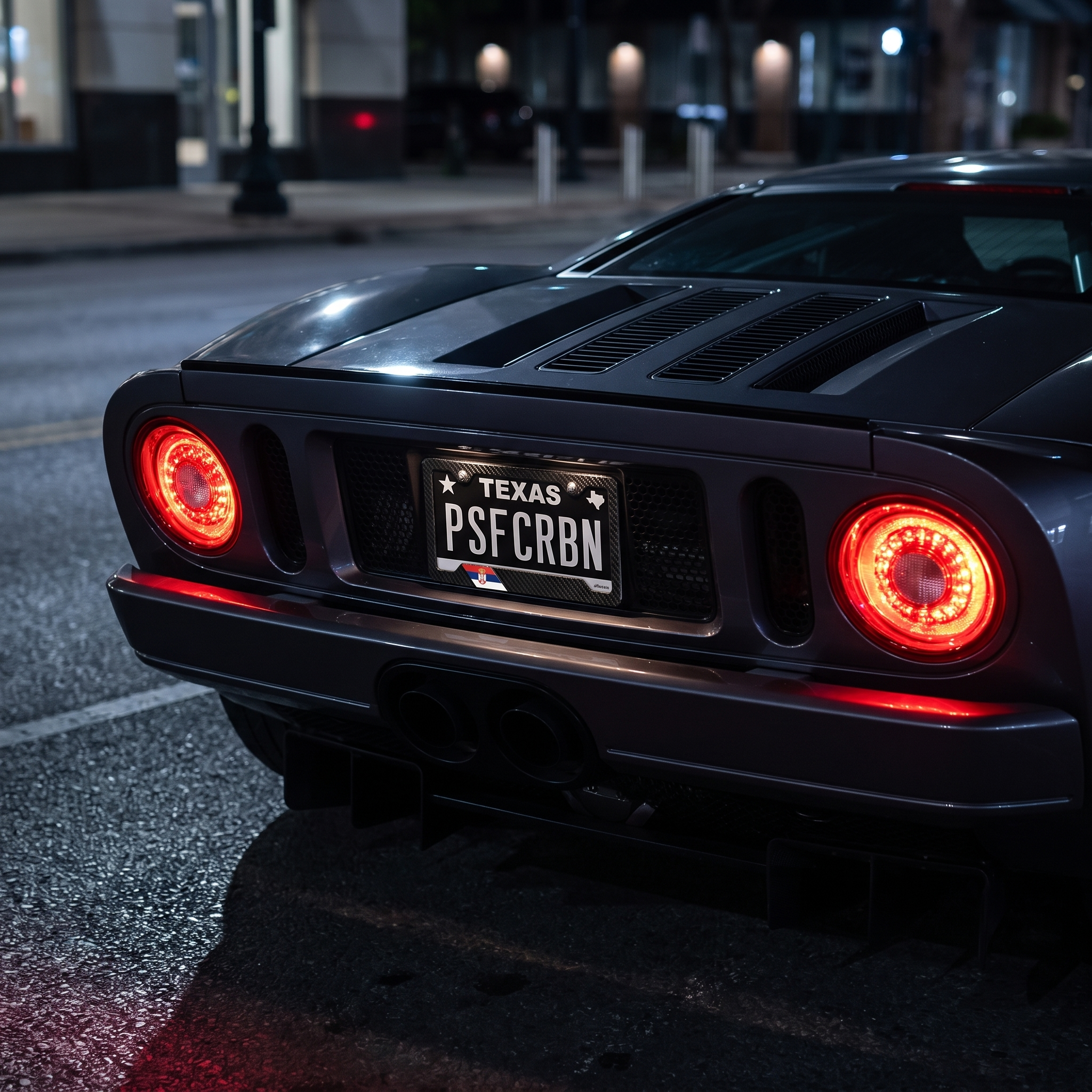 Serbia flag carbon fiber license plate frame on Ford GT at night