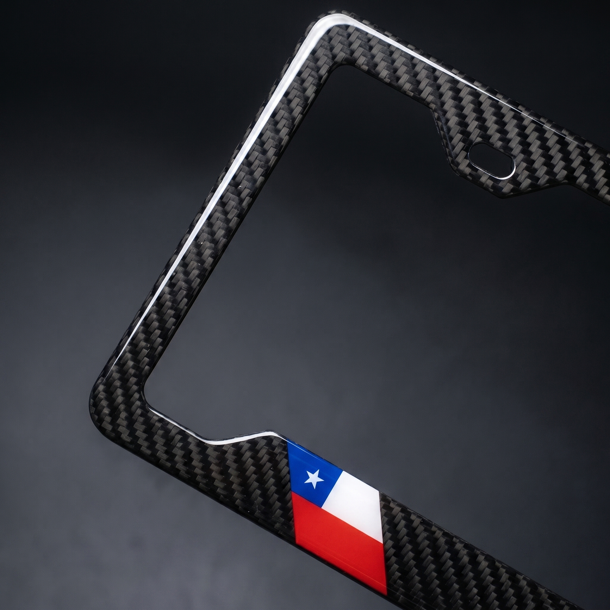 Chile flag carbon fiber license plate frame — angled corner macro