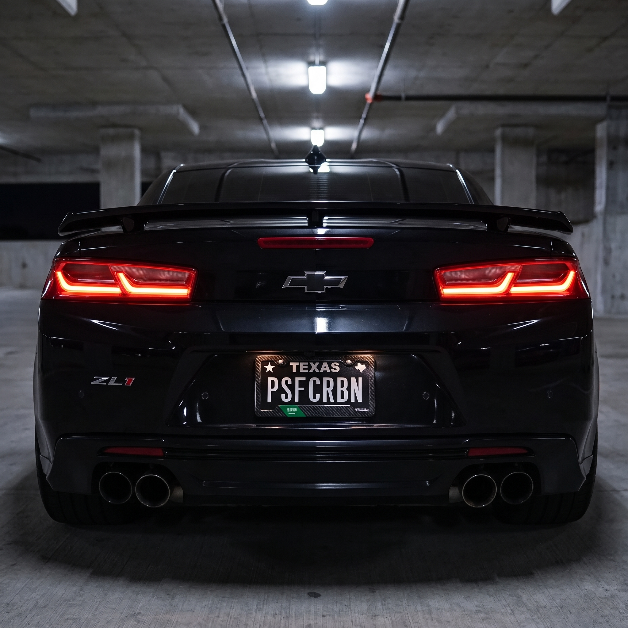 Saudi Arabia flag carbon fiber license plate frame — on-car night hero, Camaro ZL1