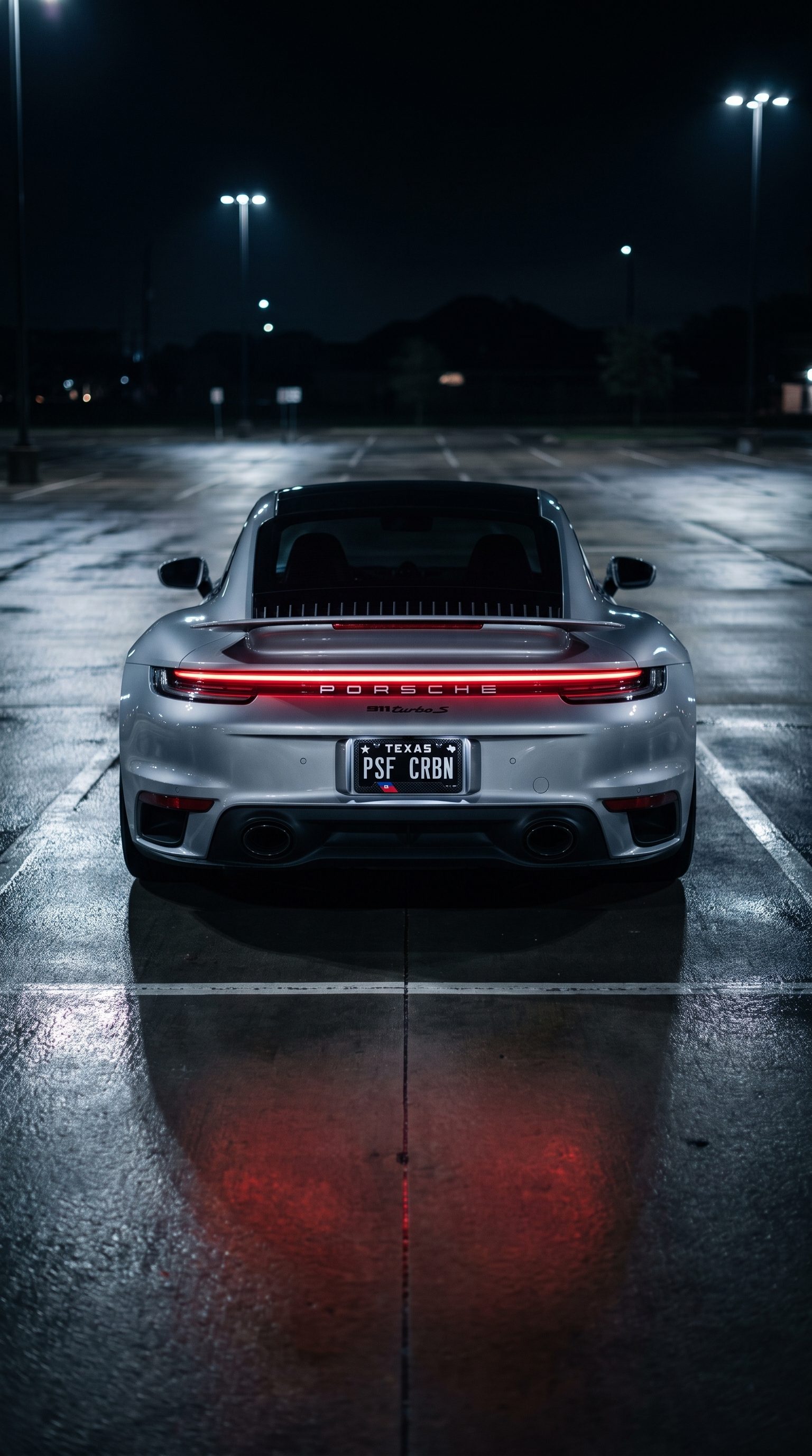 Haiti flag carbon fiber license plate frame — Porsche 911 Turbo S night parking lot