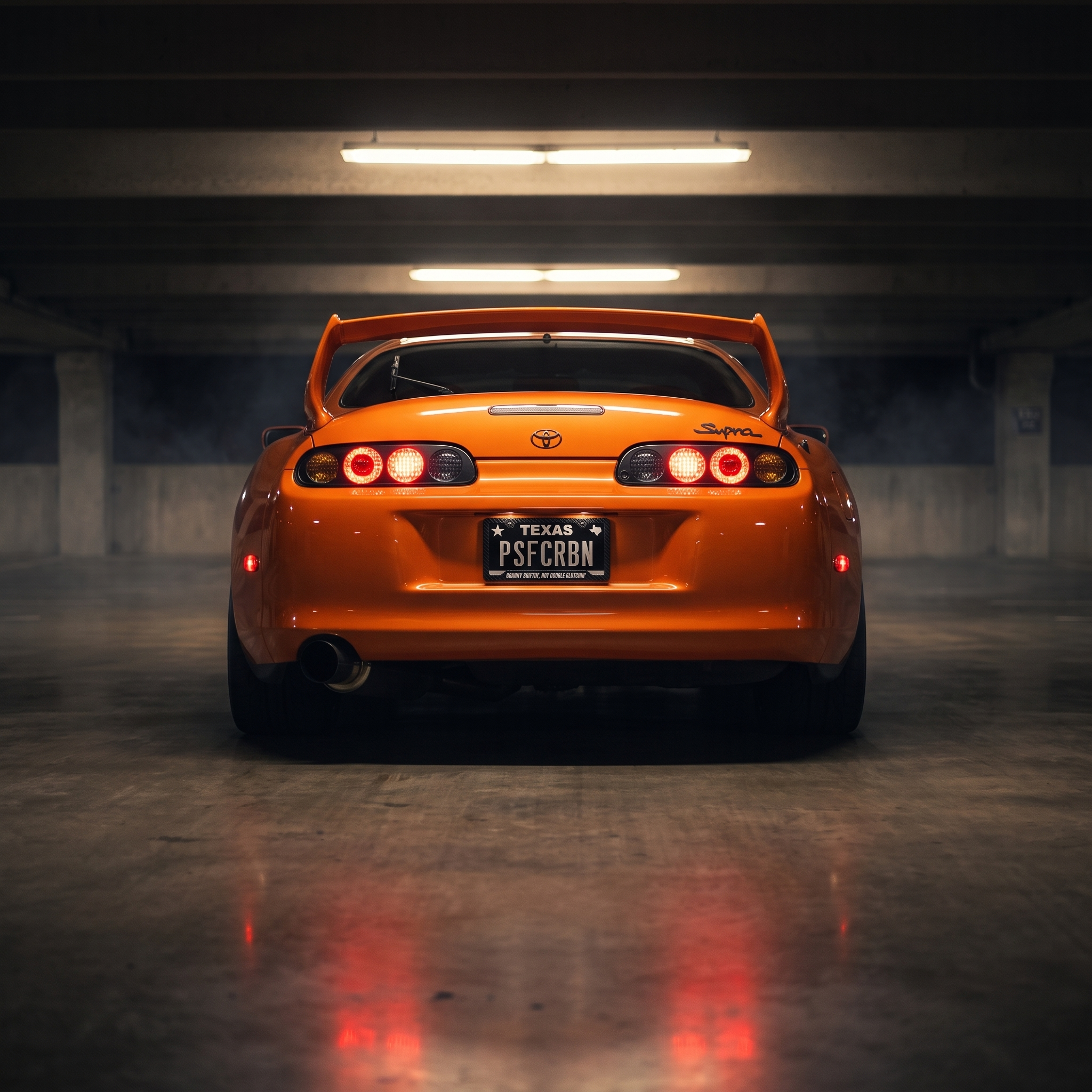 Granny Shiftin', Not Double Clutchin' frame on an orange Toyota Supra Mk4 in a night garage
