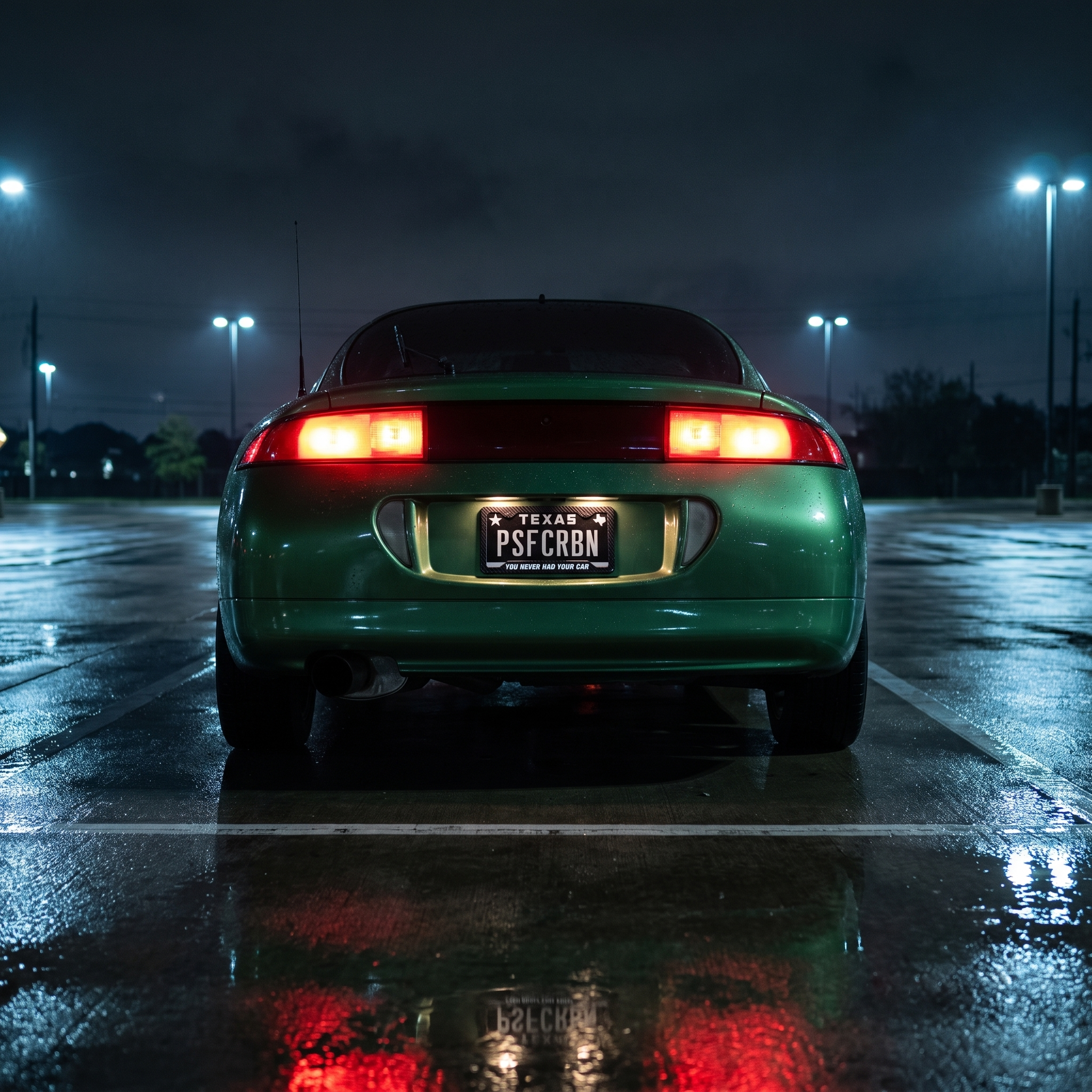 You Never Had Your Car frame on a green Mitsubishi Eclipse 2G in a wet night parking lot