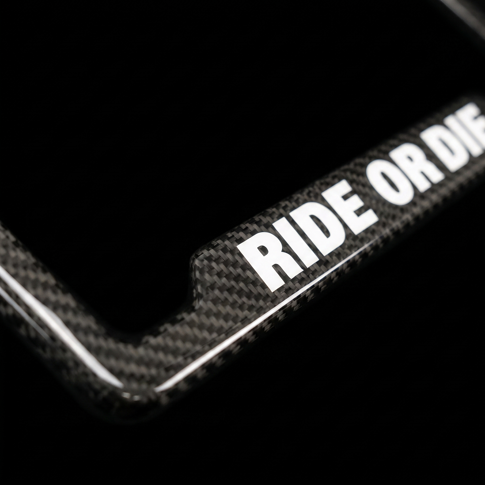 Ride Or Die carbon fiber frame macro detail