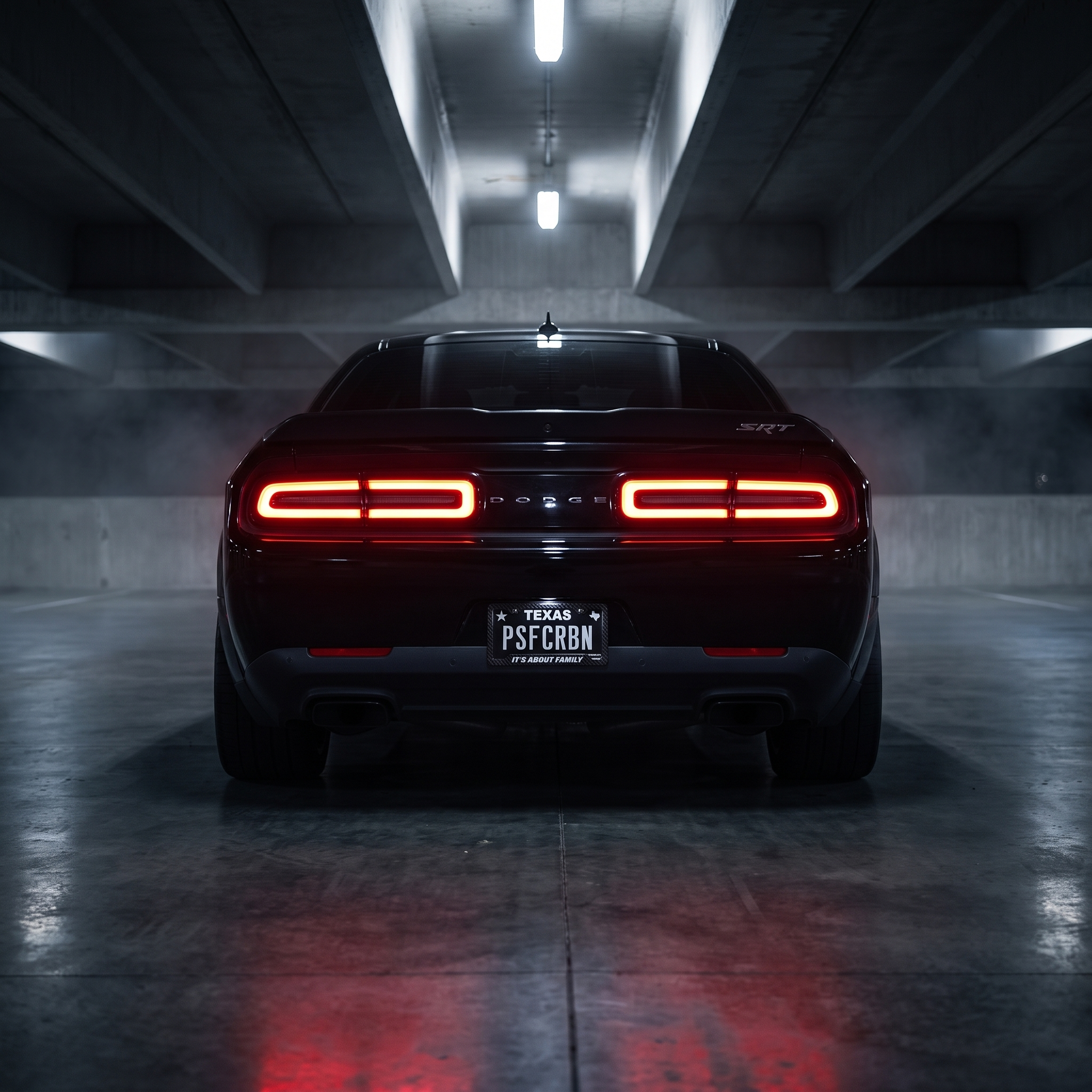 It's About Family frame on a black Dodge Challenger SRT in a night garage