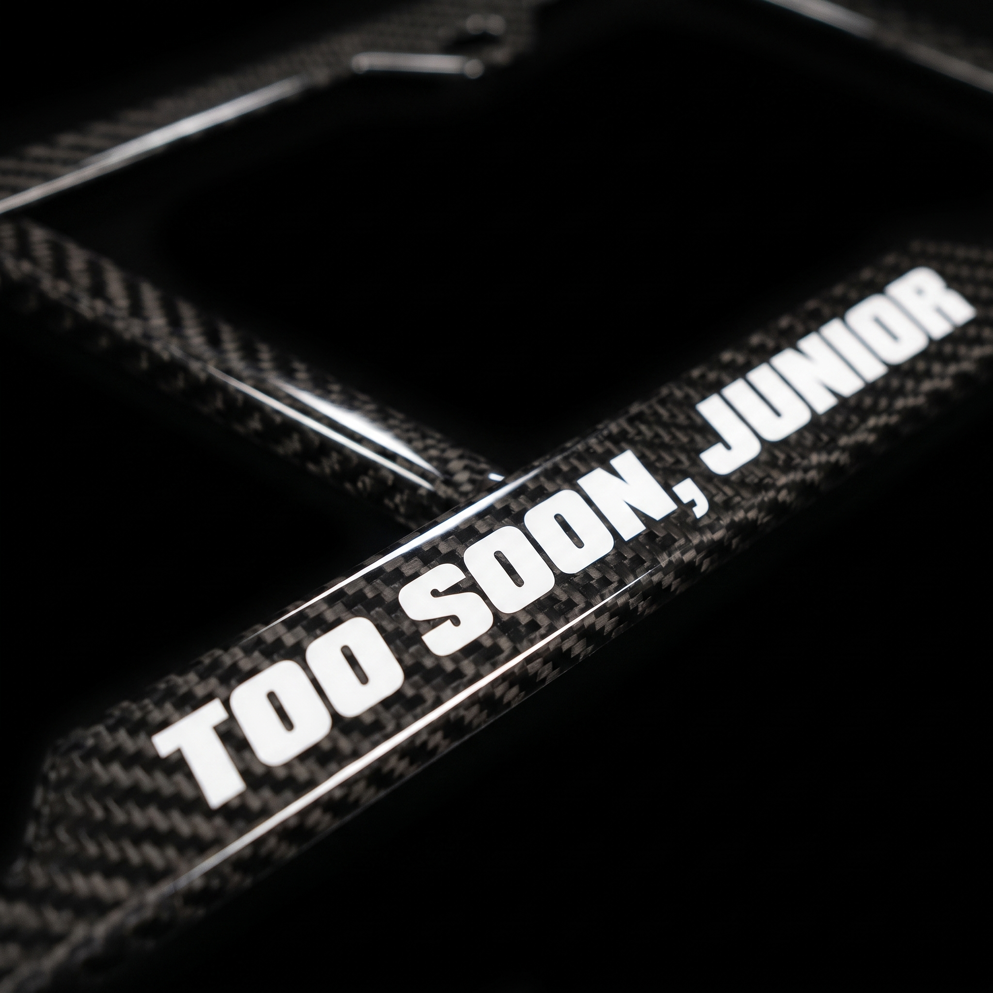 Too Soon, Junior carbon fiber frame macro detail