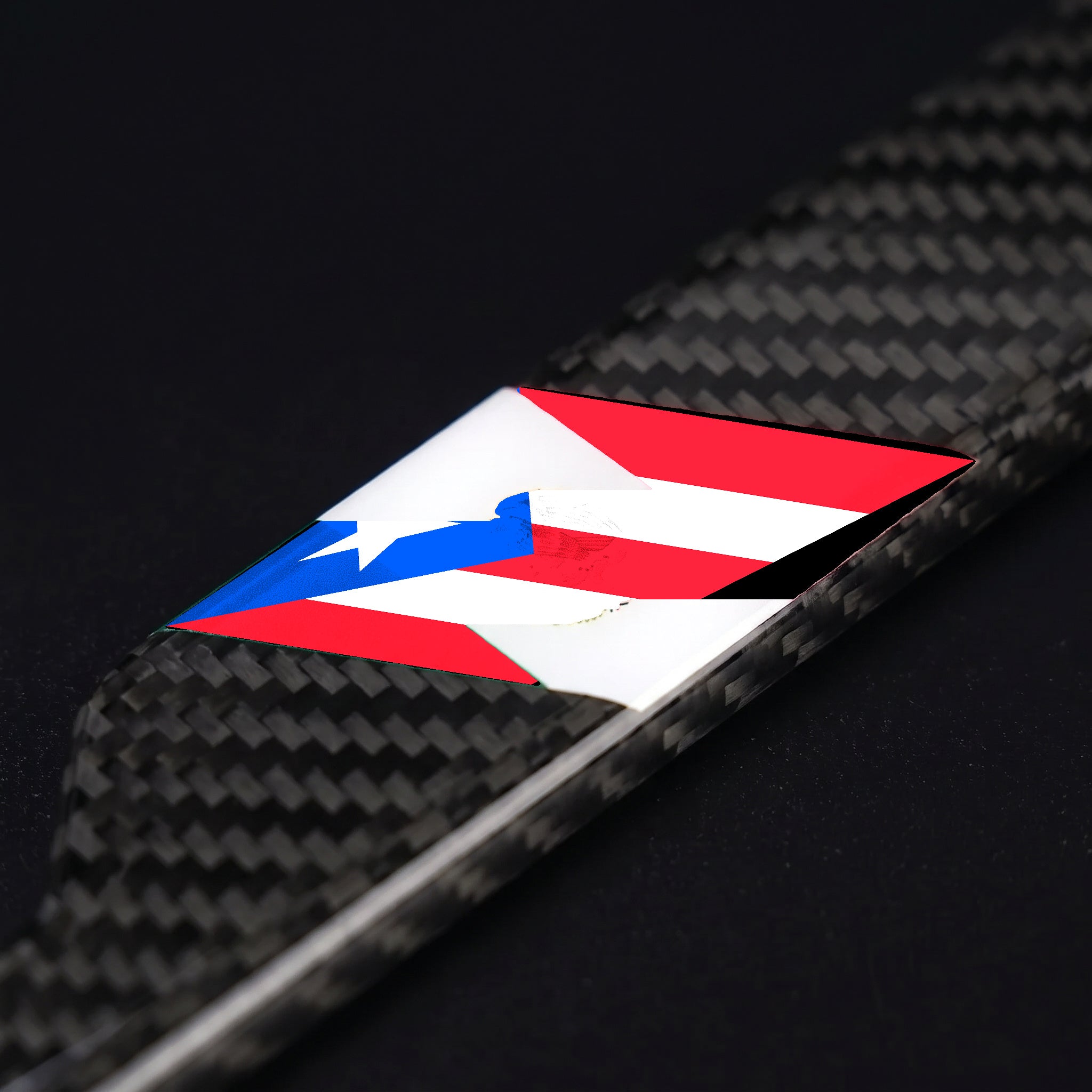 Macro of the Puerto Rico flag inlay on a PSF Carbon carbon fiber license plate frame