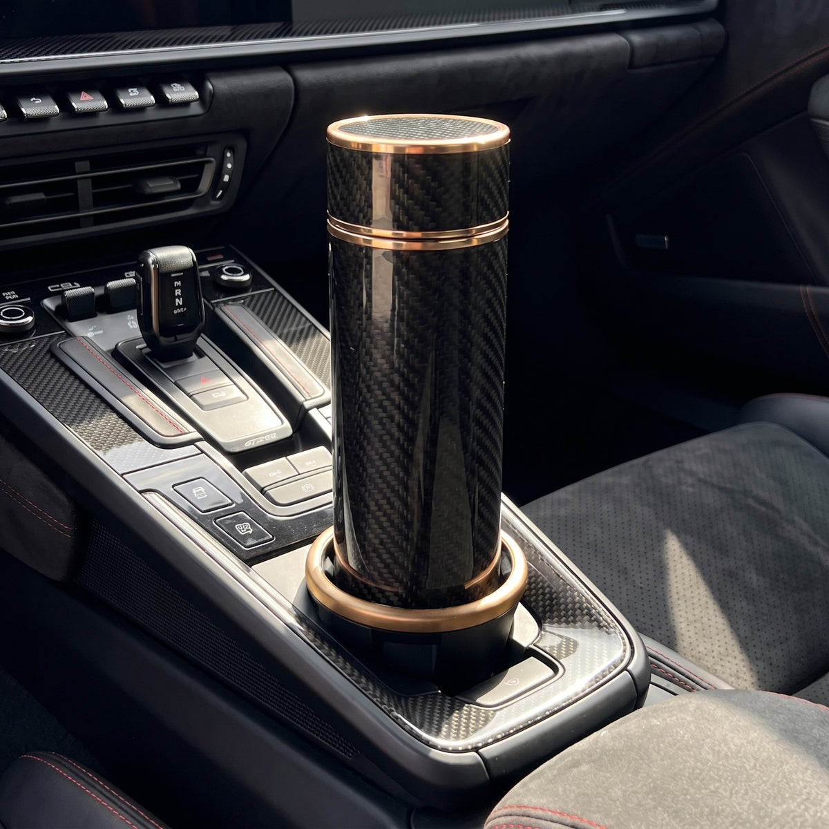 CarbonFlow Gold in the GT3 RS center console cupholder
