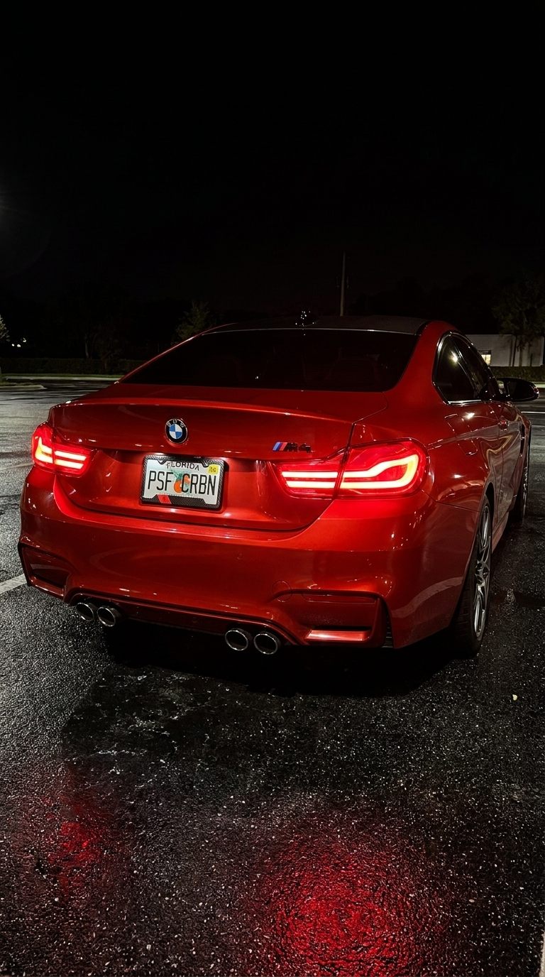 Morocco carbon plate frame on a red BMW M4, taillights on
