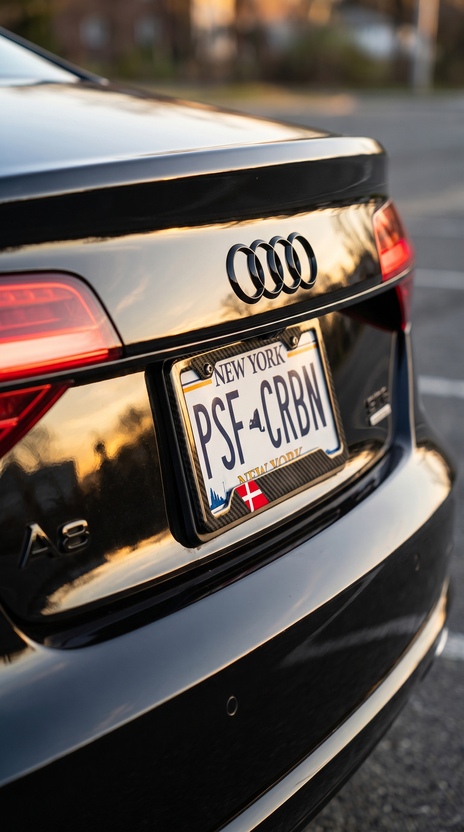 Denmark flag carbon fiber license plate frame three-quarter angle on black Audi A8