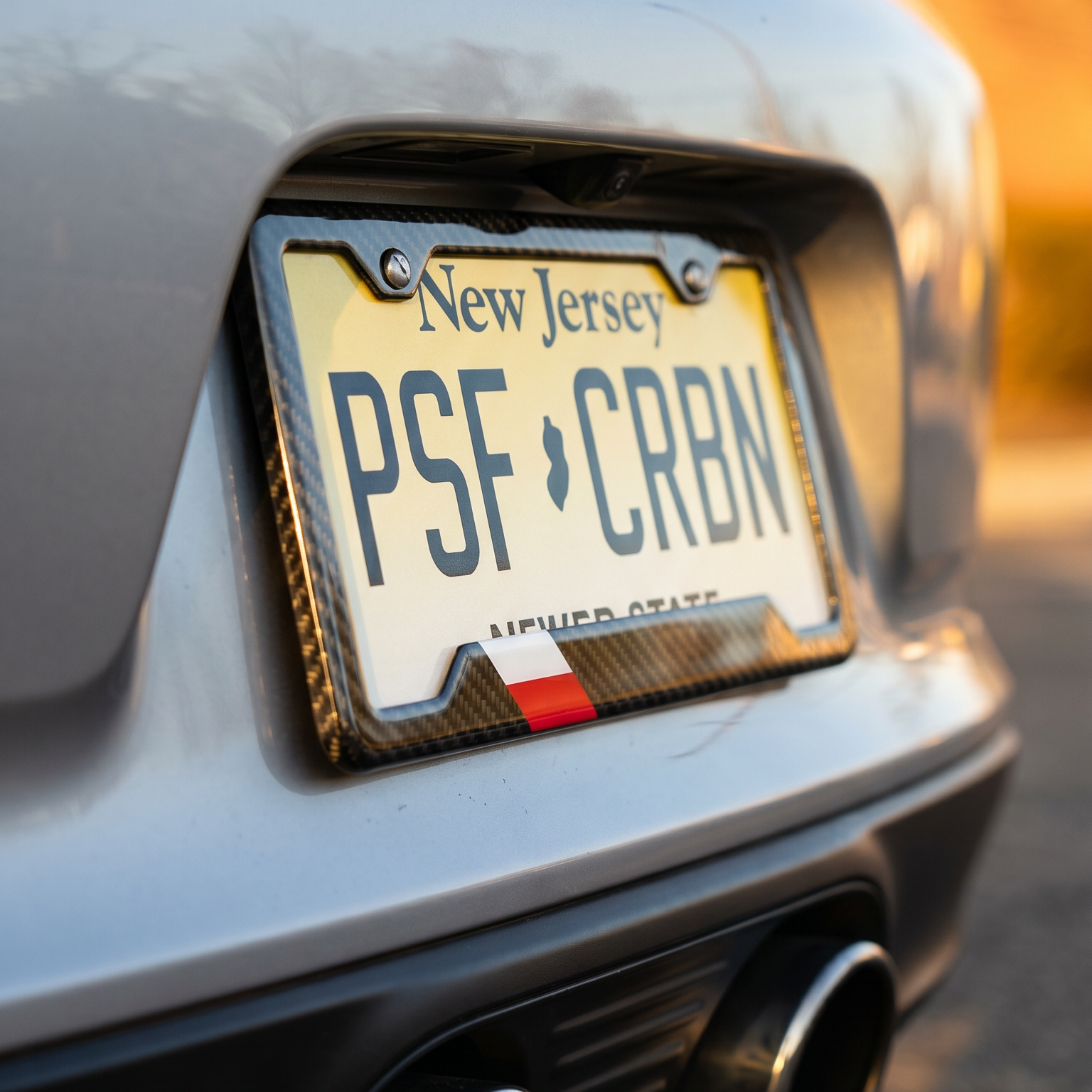 Poland flag carbon fiber license plate frame three-quarter angle on silver Porsche 911