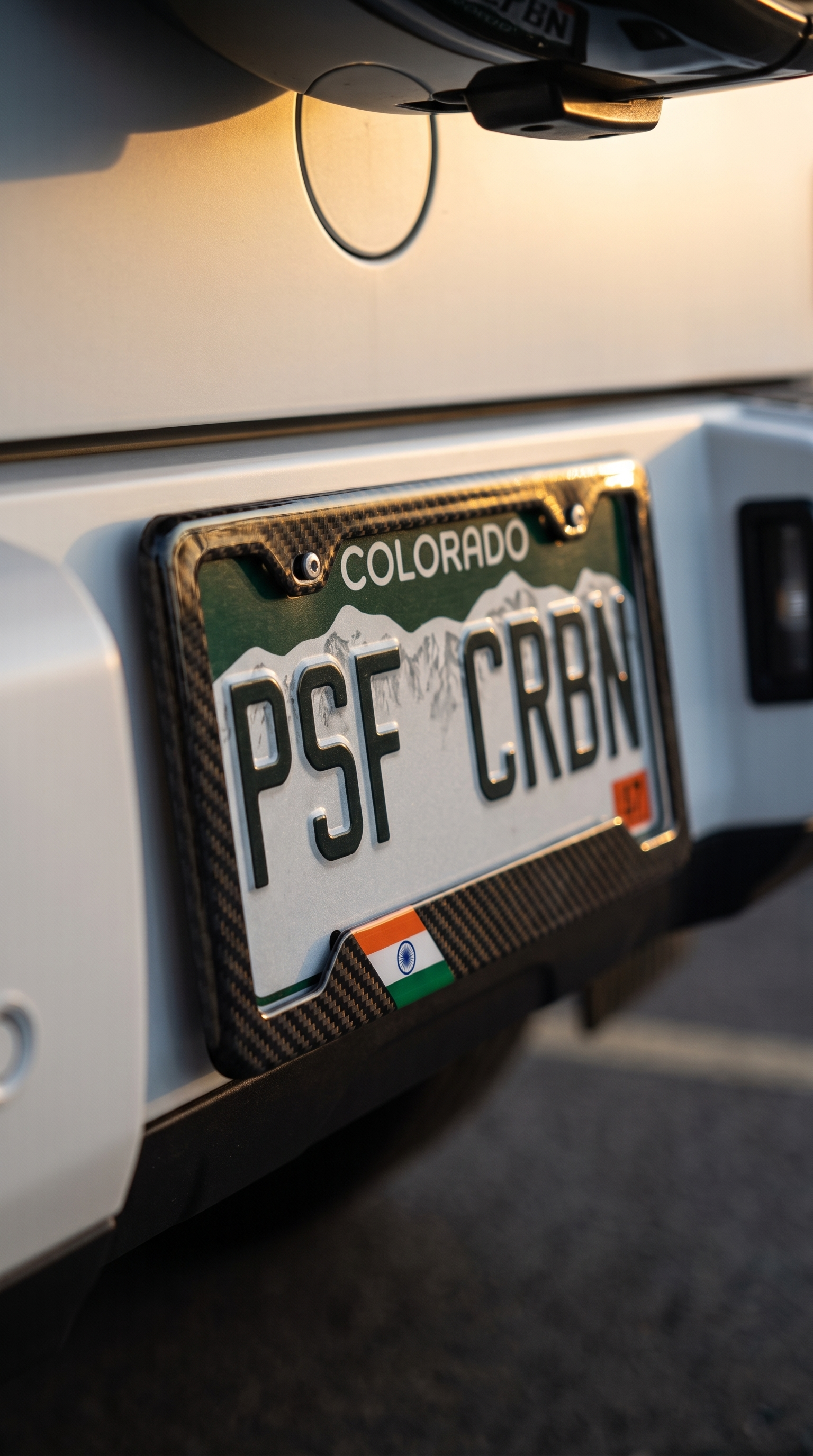 India flag carbon fiber license plate frame on Mercedes G-Wagon, three-quarter angle, Colorado plate PSF CRBN