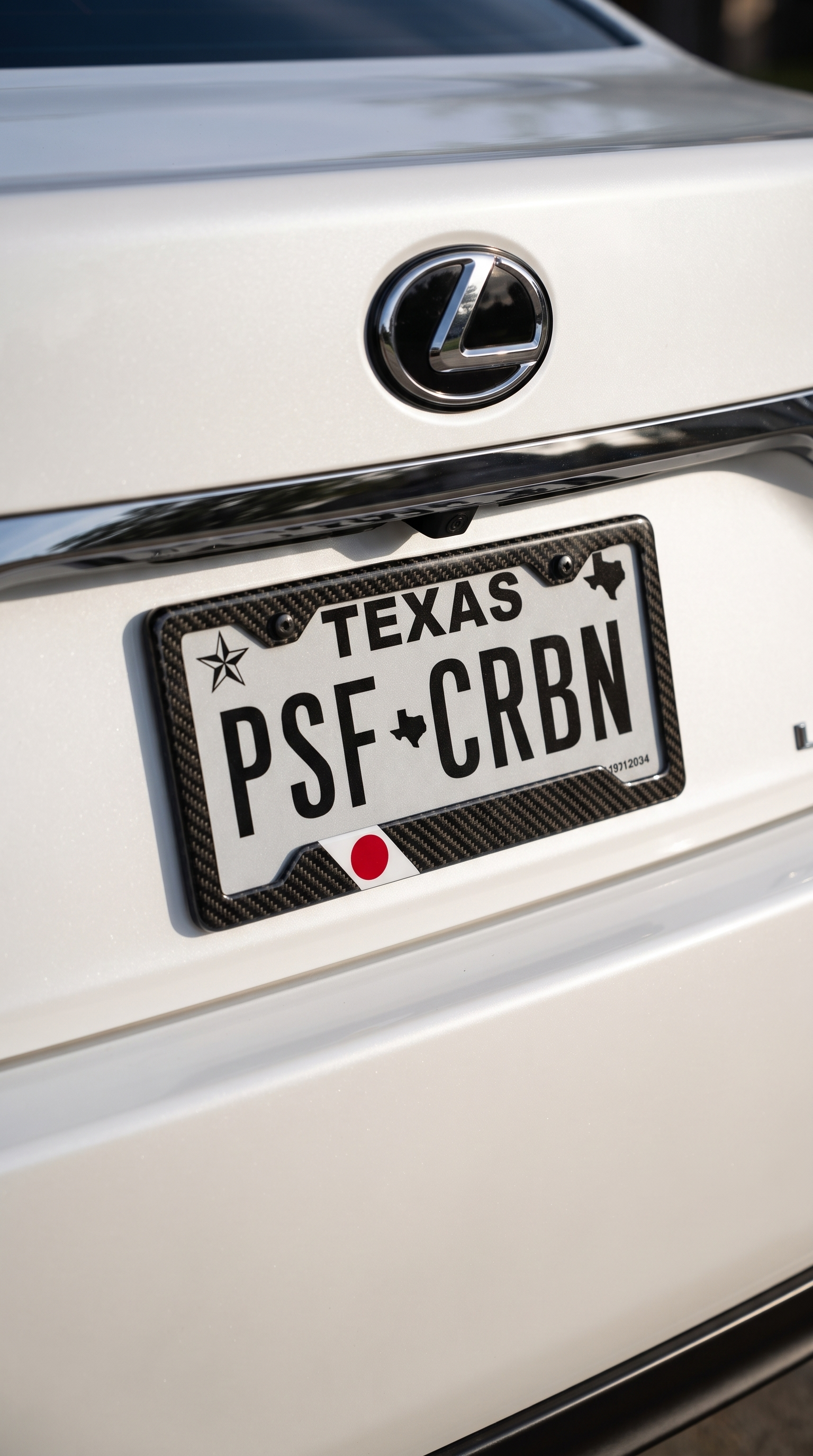 Japan flag carbon fiber license plate frame on Lexus LS, close-up, Texas plate PSF CRBN