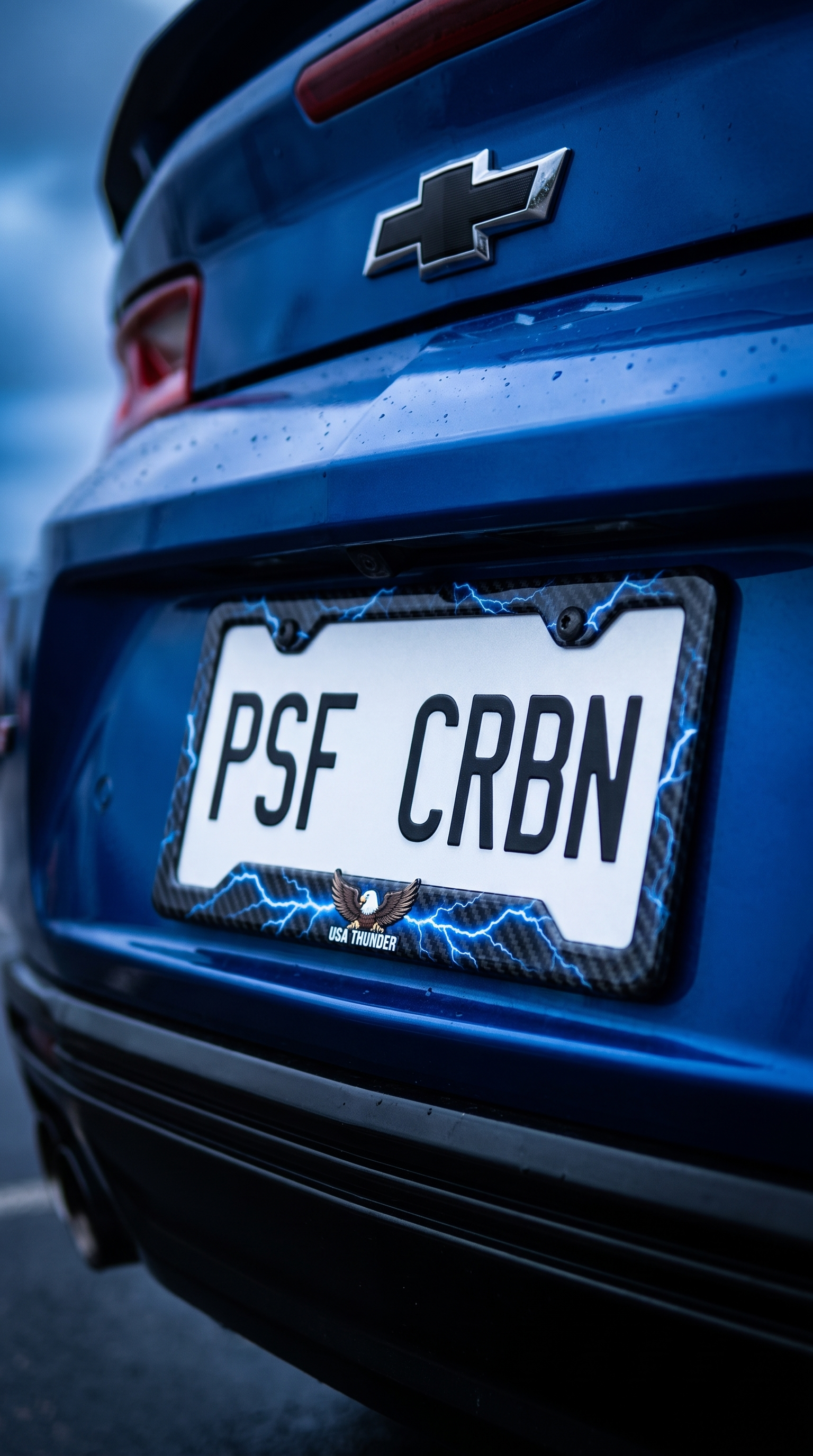 USA Thunder lightning carbon fiber plate frame on a blue Chevrolet Camaro SS