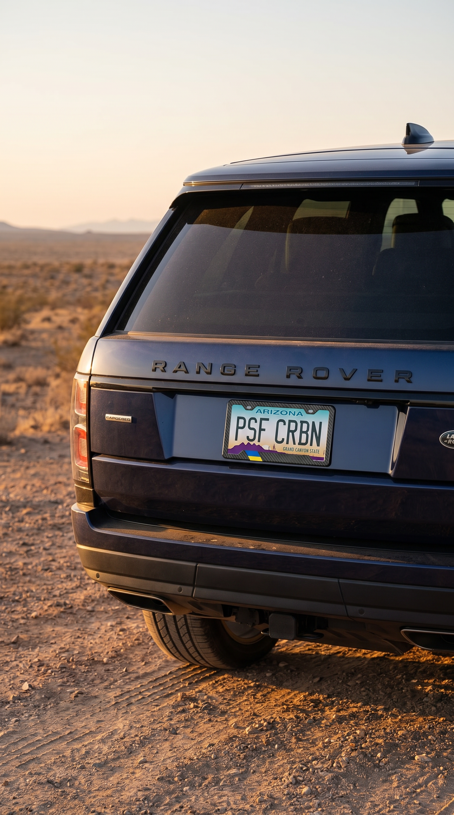 Ukraine flag carbon fiber license plate frame three-quarter angle on dark blue Range Rover