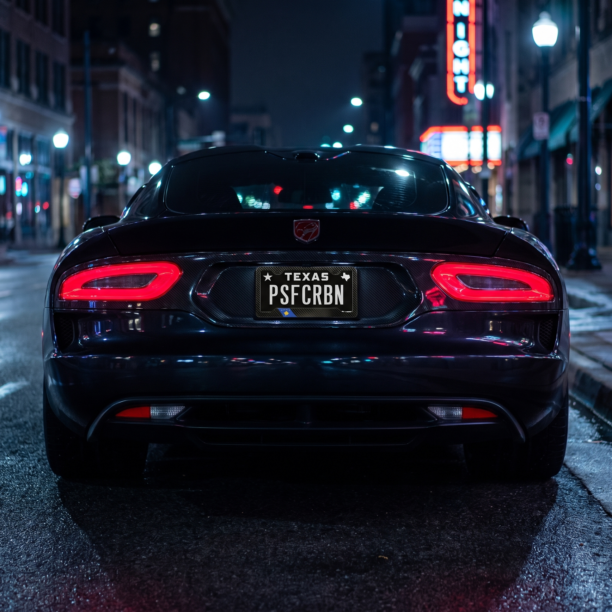 Kosovo flag carbon fiber license plate frame on Dodge Viper at night