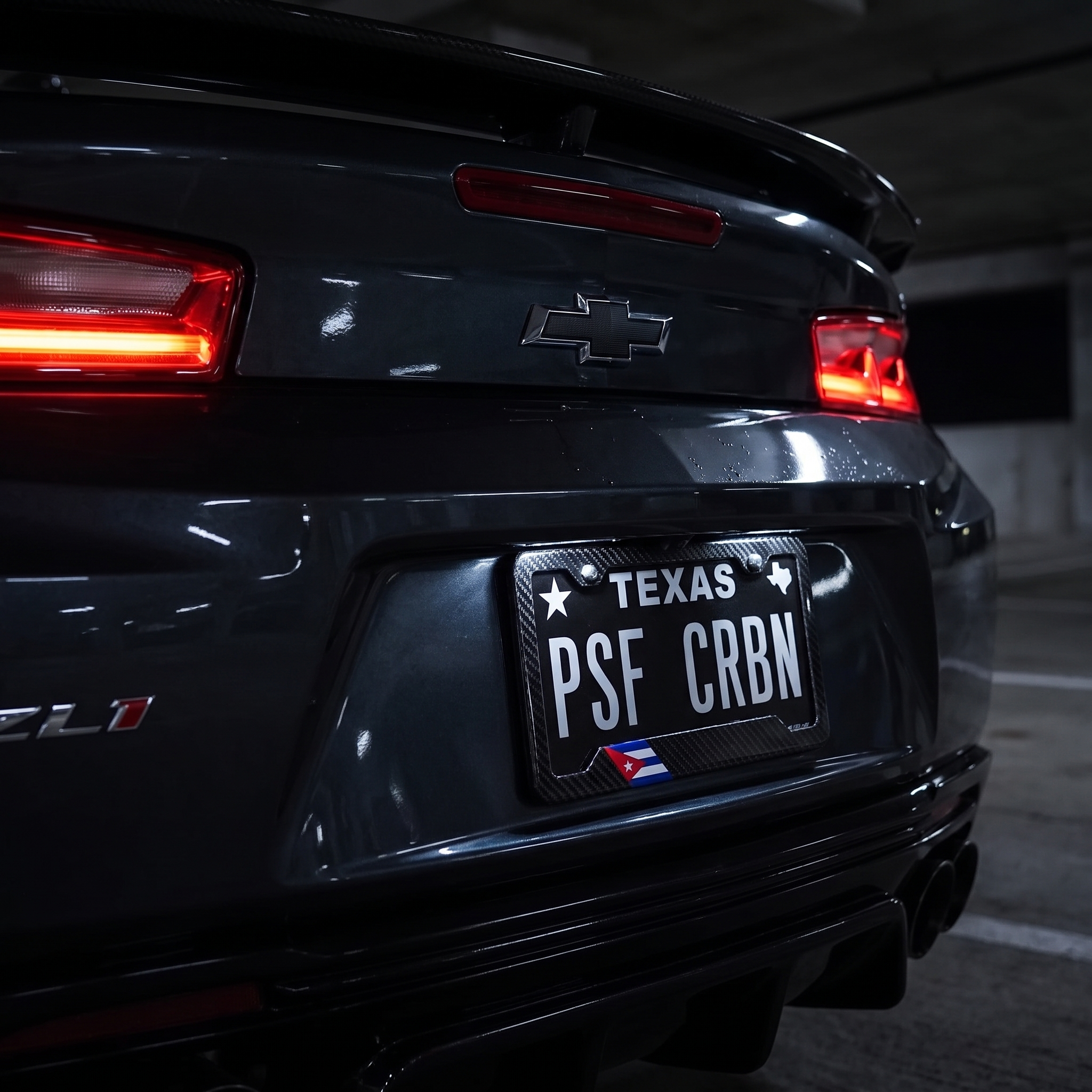 Cuba flag carbon fiber license plate frame — on-car night hero, Chevrolet Camaro ZL1