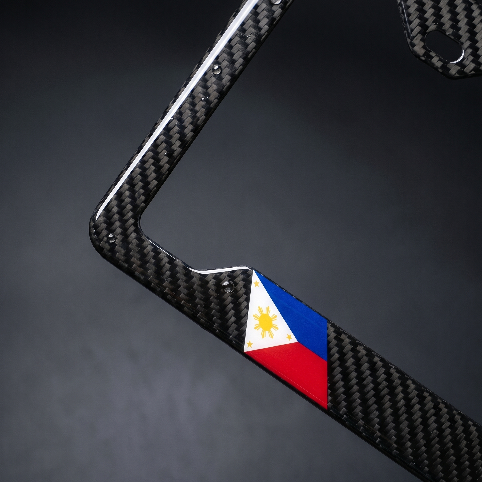 Philippines flag carbon fiber license plate frame — angled macro