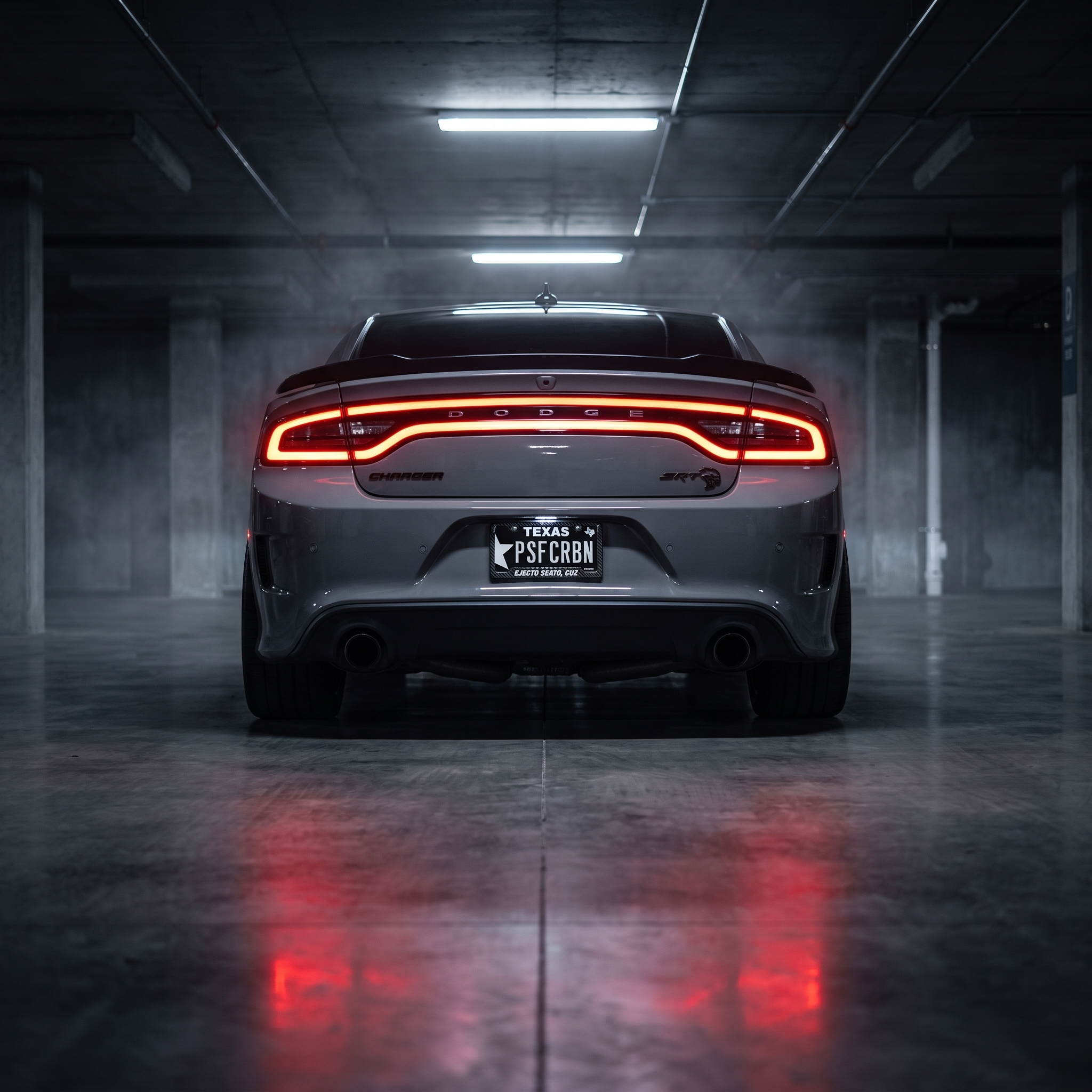 Ejecto Seato, Cuz frame on a grey Dodge Charger SRT Hellcat in a night garage