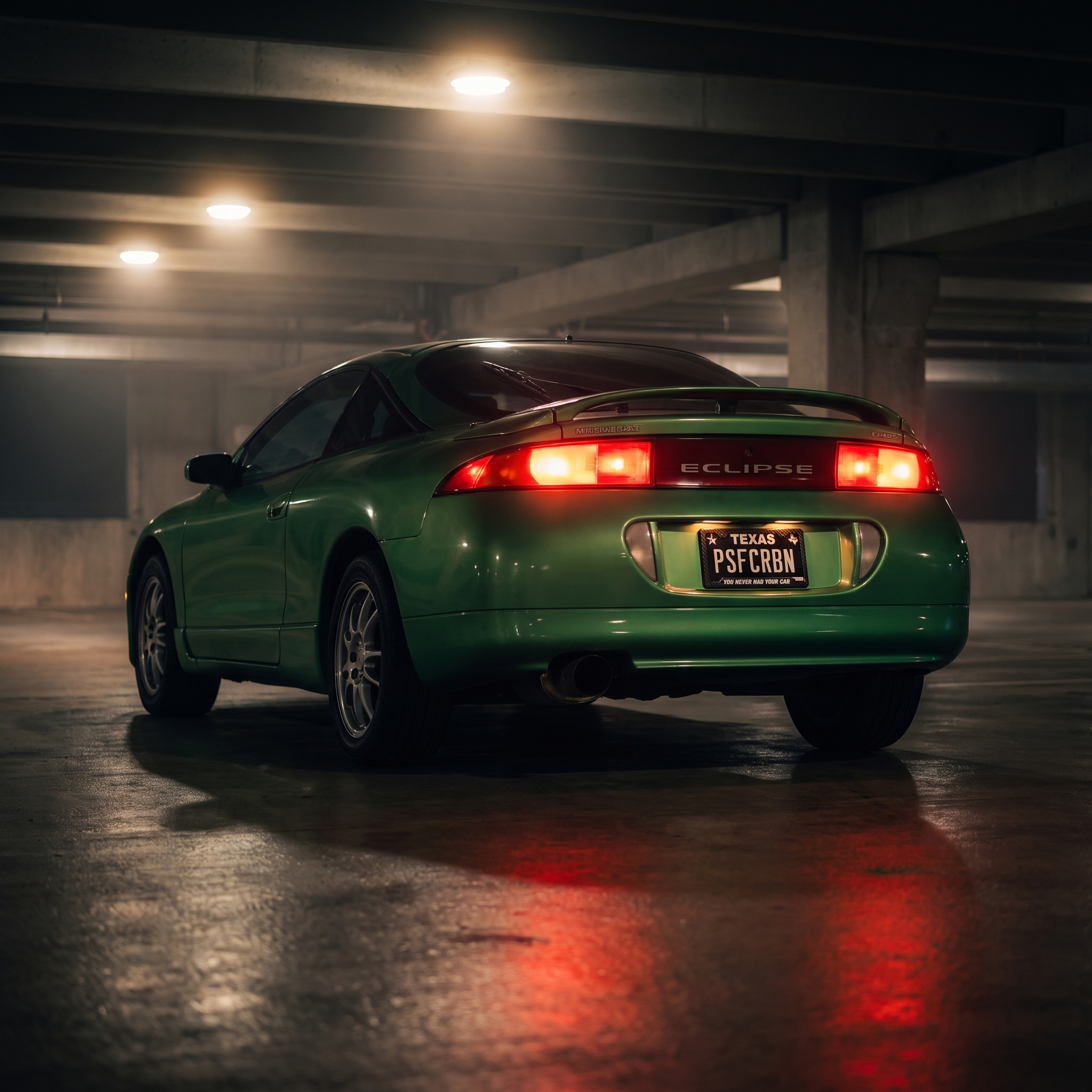 You Never Had Your Car frame on a green Mitsubishi Eclipse 2G in a night garage