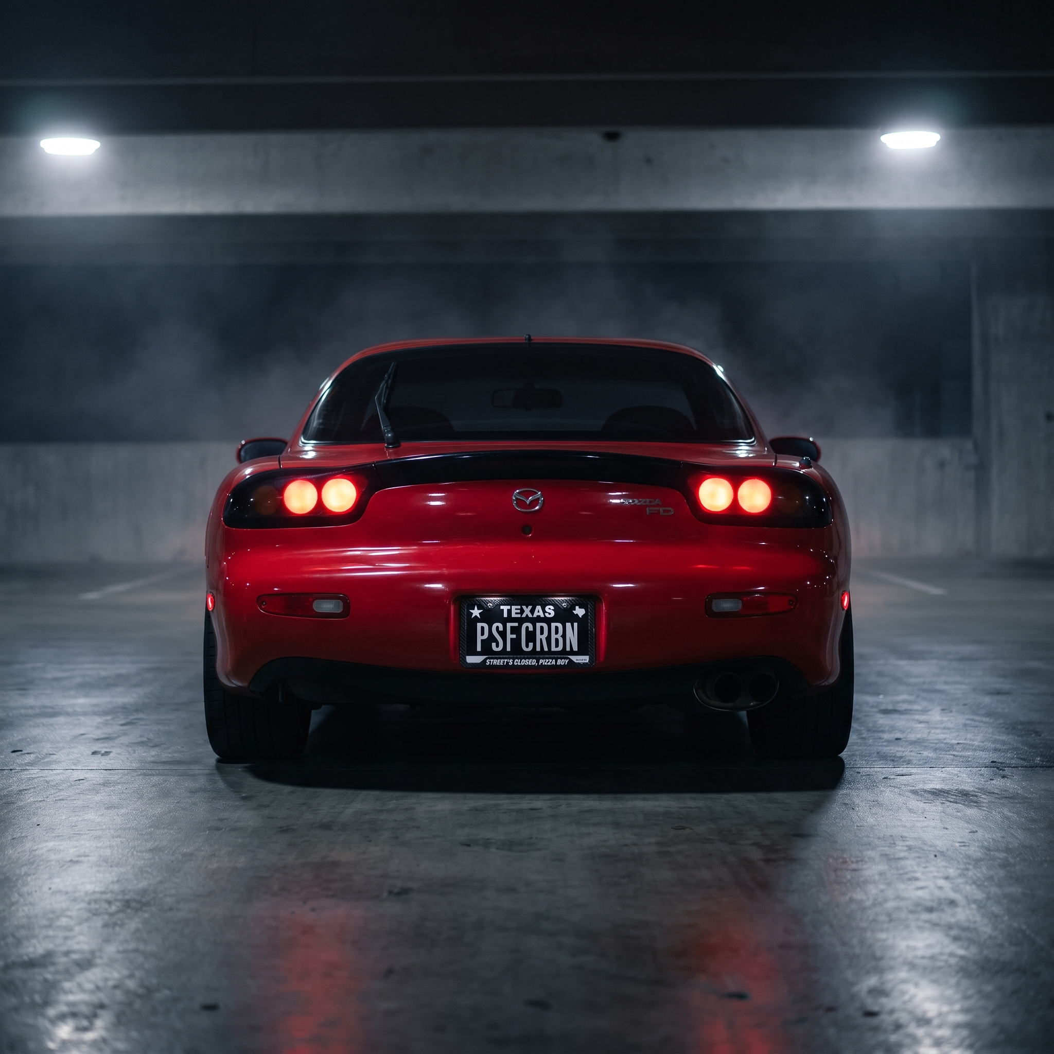 Street's Closed, Pizza Boy frame on a red Mazda RX-7 FD in a night garage