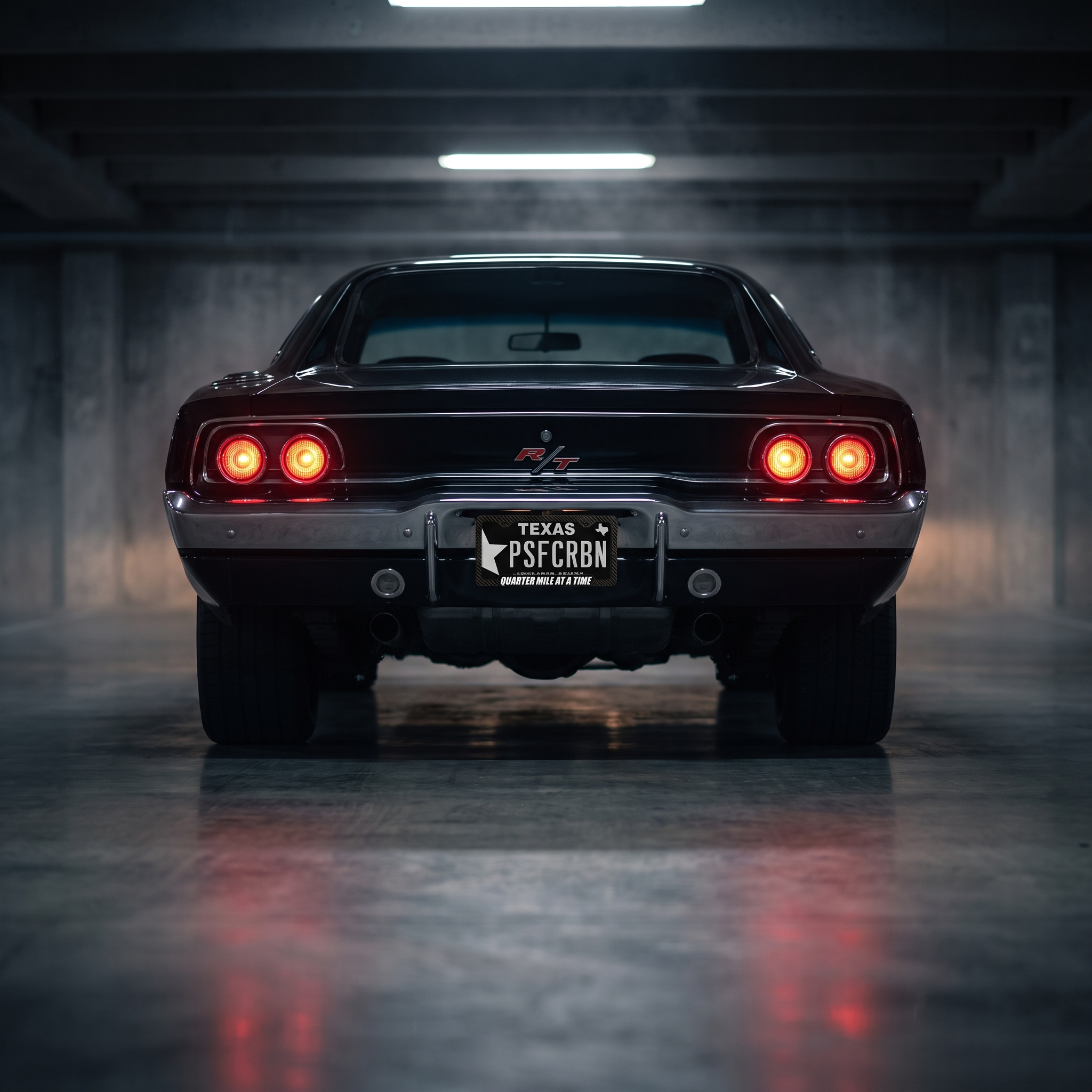 Quarter Mile At A Time frame on a black 1970 Dodge Charger R/T in a night garage
