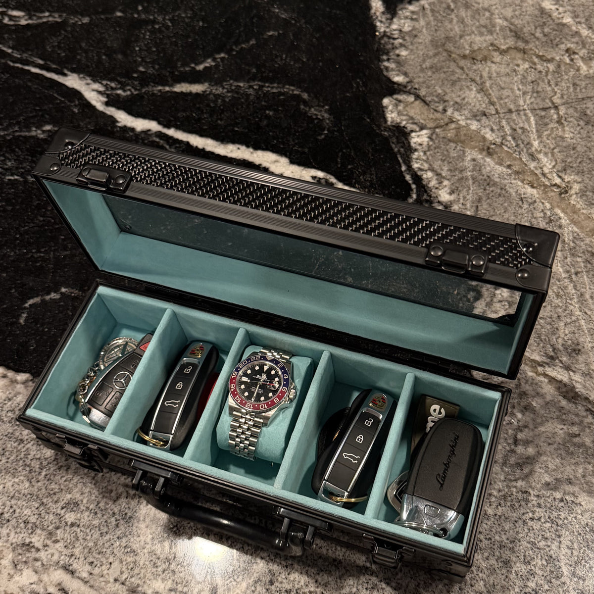 The Motorcase 5 Slot open with keys, Tiffany blue suede interior #Colour_Tiffany Blue
