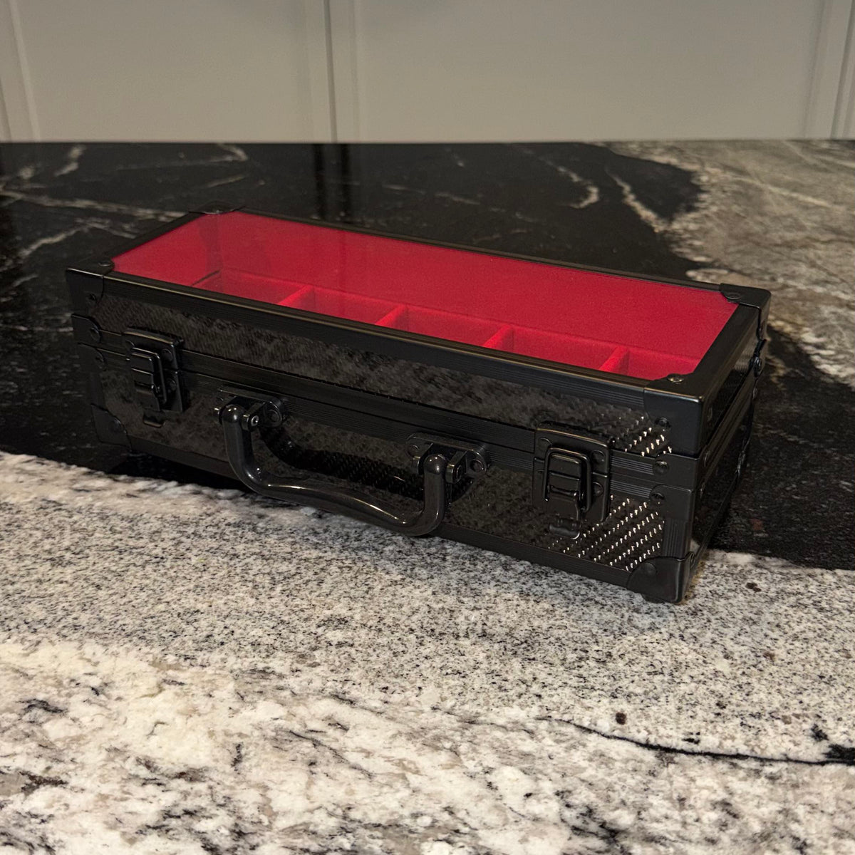 Closed, twin latches, red interior showing through the lid #Colour_Red