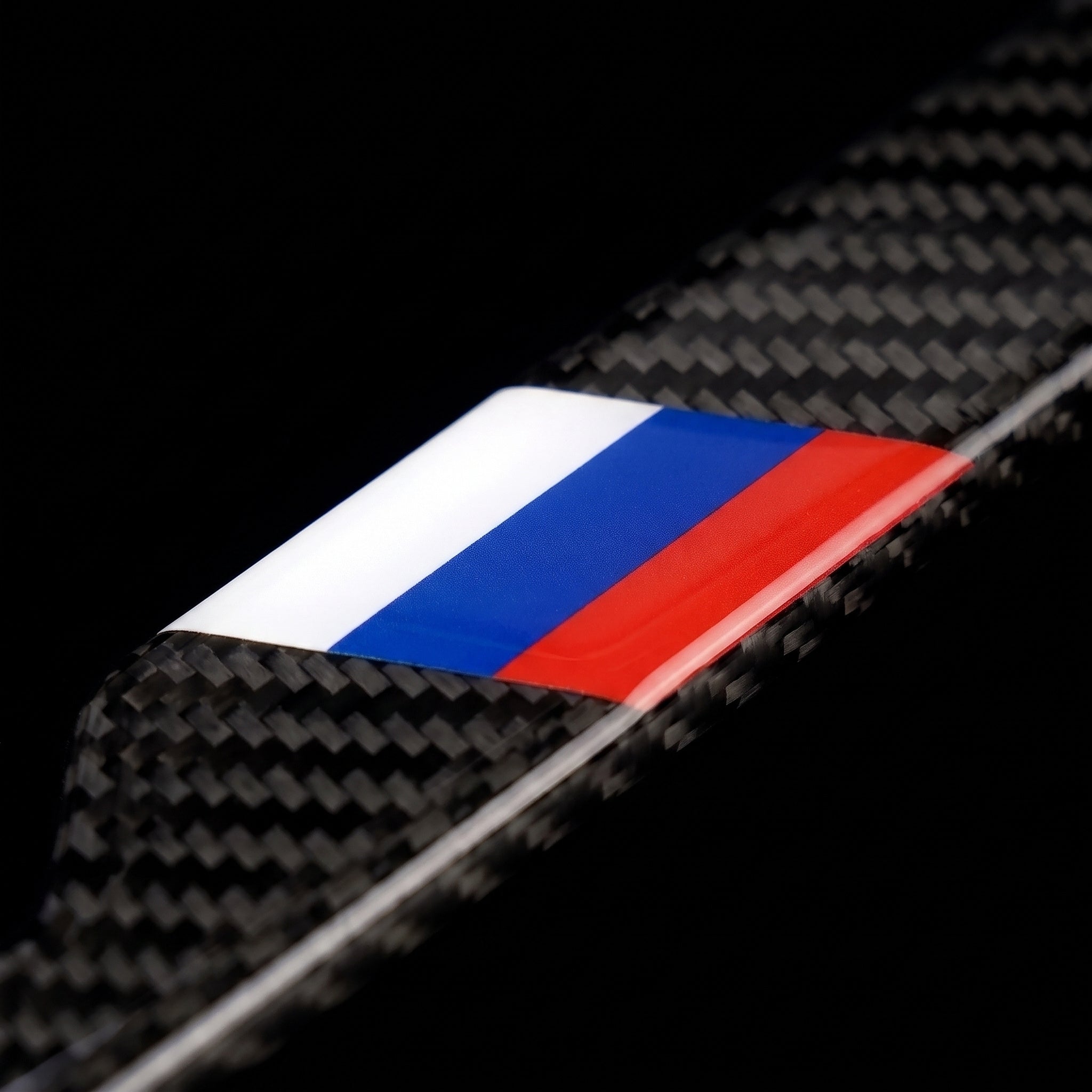 Macro of the Russia flag inlay on a PSF Carbon carbon fiber license plate frame